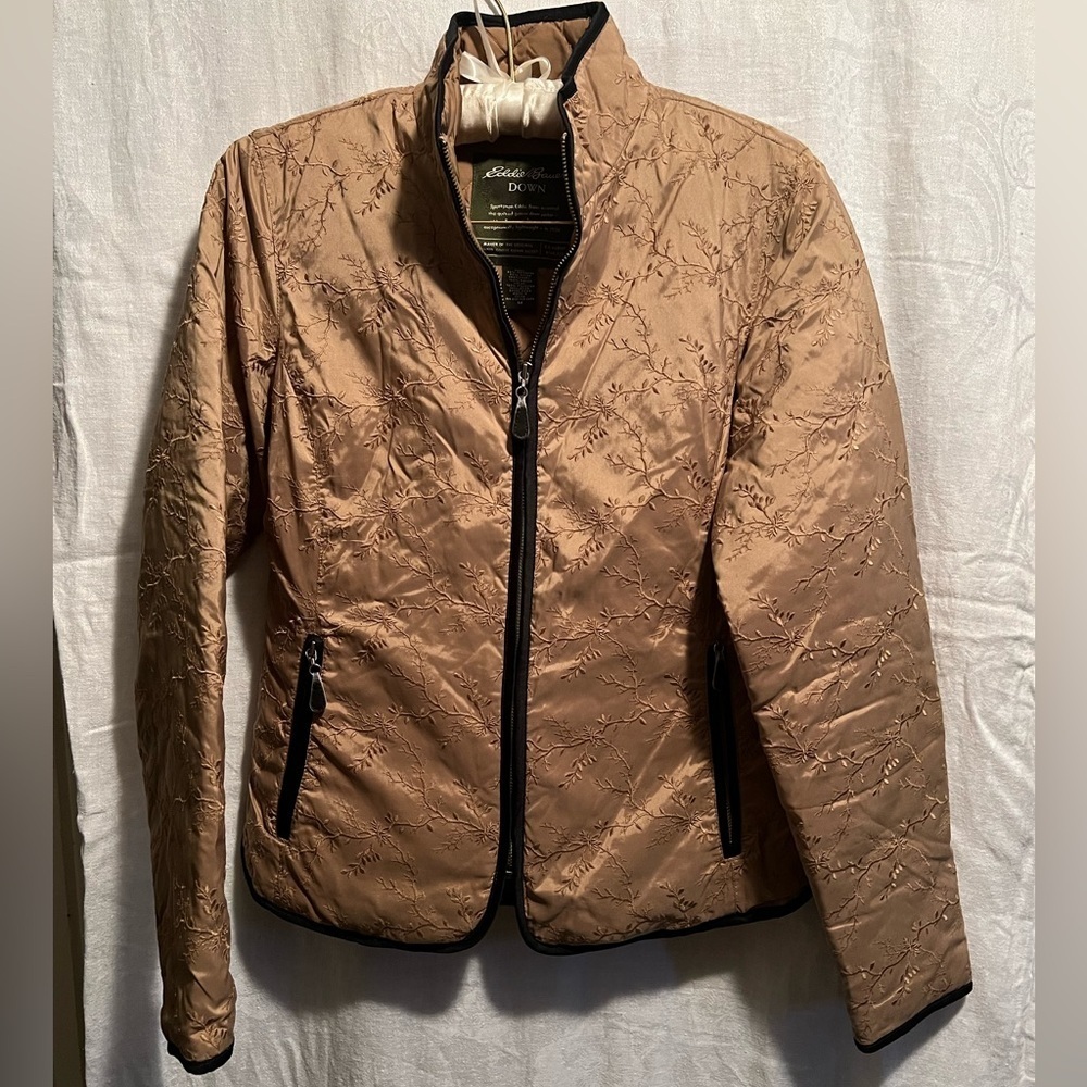 Eddie Bauer Down Jacket. Gold with black edges. Size medium. Design on coat.